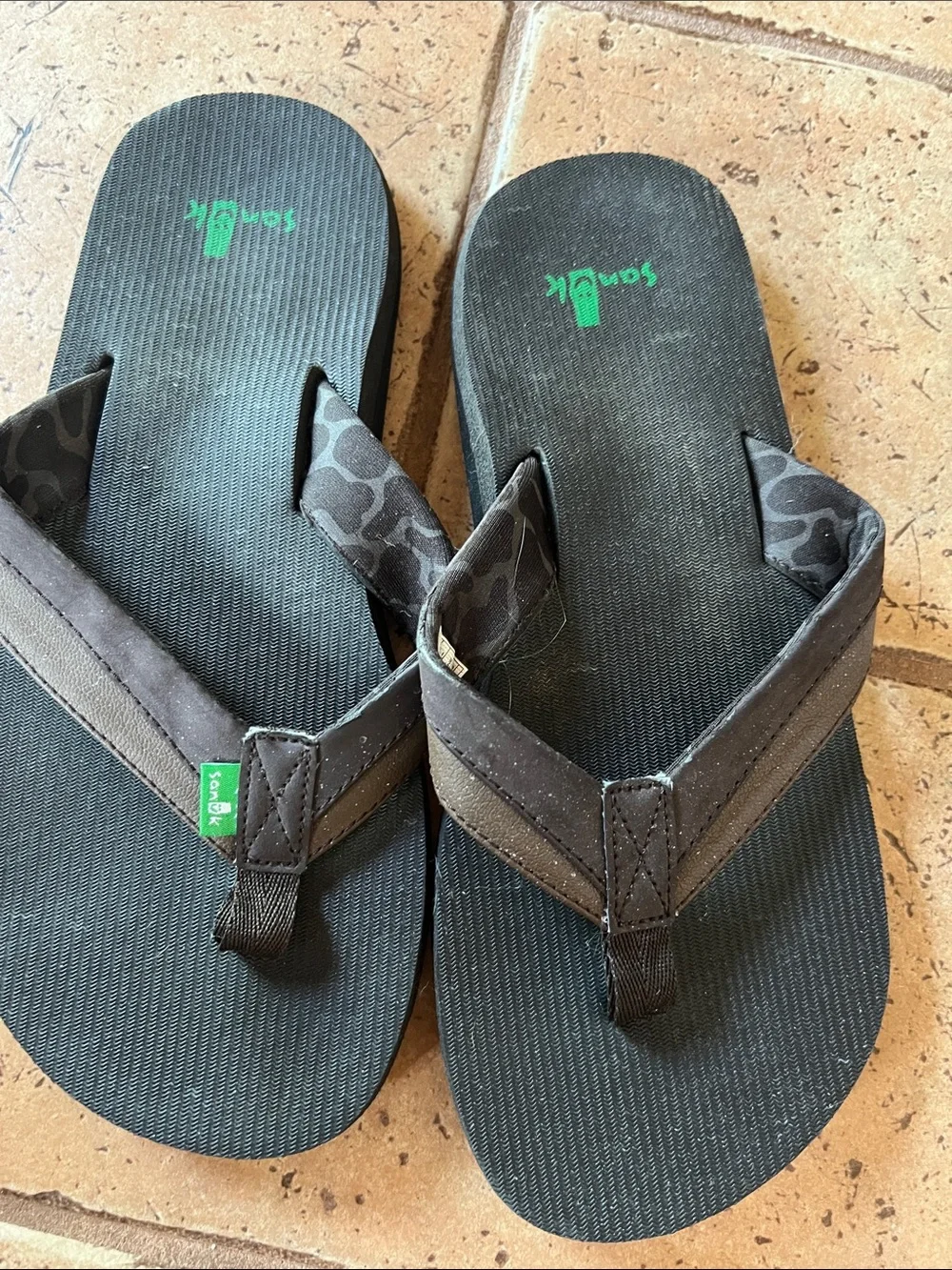 Sanuk Black Flip Flops with Green Logo Accent